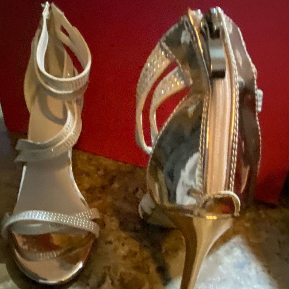 Gold stiletto heels zip up back